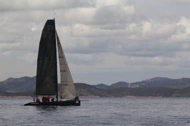 Bodrum,Turkey. 19 January 2019: Sailboats sail in windy weather in the blue waters of the Aegean Sea, on the shores of the famous holiday destination Bodrum.