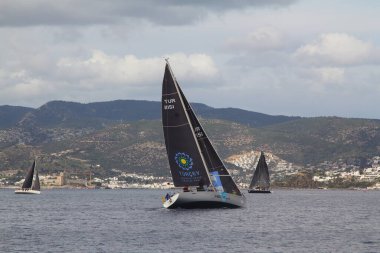Bodrum,Turkey. 19 January 2019: Sailboats sail in windy weather in the blue waters of the Aegean Sea, on the shores of the famous holiday destination Bodrum.
