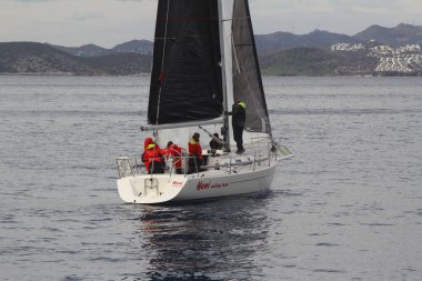 Bodrum,Turkey. 19 January 2019: Sailboats sail in windy weather in the blue waters of the Aegean Sea, on the shores of the famous holiday destination Bodrum.