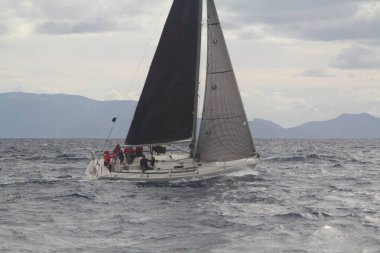 Bodrum,Turkey. 19 January 2019: Sailboats sail in windy weather in the blue waters of the Aegean Sea, on the shores of the famous holiday destination Bodrum.
