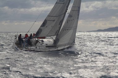 Bodrum,Turkey. 19 January 2019: Sailboats sail in windy weather in the blue waters of the Aegean Sea, on the shores of the famous holiday destination Bodrum.