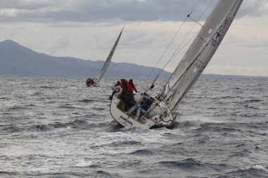 Bodrum,Turkey. 19 January 2019: Sailboats sail in windy weather in the blue waters of the Aegean Sea, on the shores of the famous holiday destination Bodrum.
