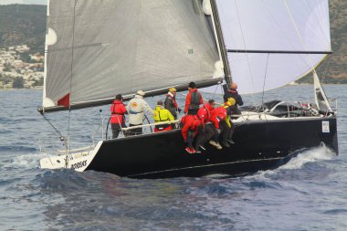 Bodrum,Turkey. 19 January 2019: Sailboats sail in windy weather in the blue waters of the Aegean Sea, on the shores of the famous holiday destination Bodrum.
