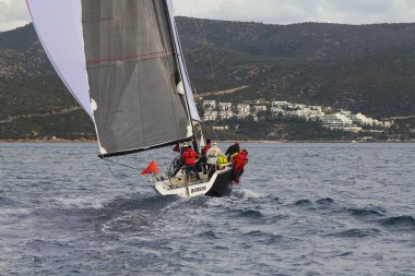 Bodrum,Turkey. 19 January 2019: Sailboats sail in windy weather in the blue waters of the Aegean Sea, on the shores of the famous holiday destination Bodrum.
