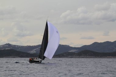 Bodrum,Turkey. 19 January 2019: Sailboats sail in windy weather in the blue waters of the Aegean Sea, on the shores of the famous holiday destination Bodrum.