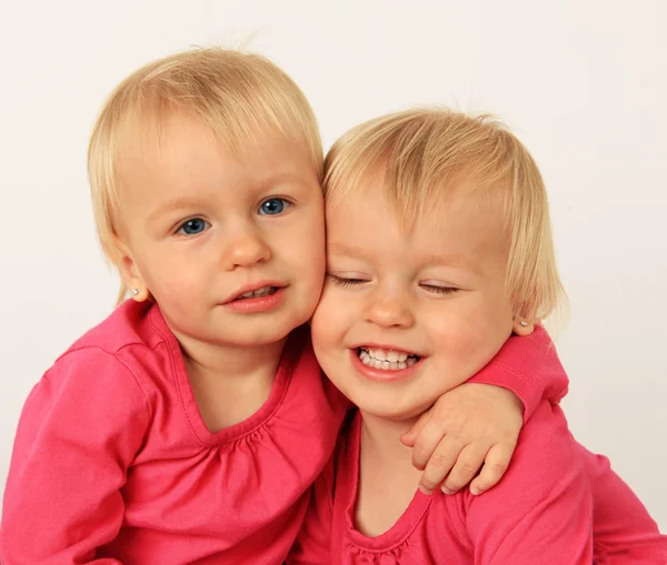 Little twin girls hugging — Stock Photo, Image