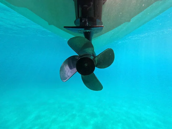 underwater shot of a propeller of a motor boat in the sea.