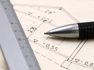architecture plan of a house with pen and ruler, close up.