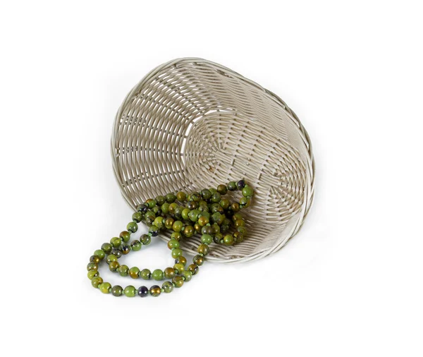 Basket with green beads — Stock Photo, Image