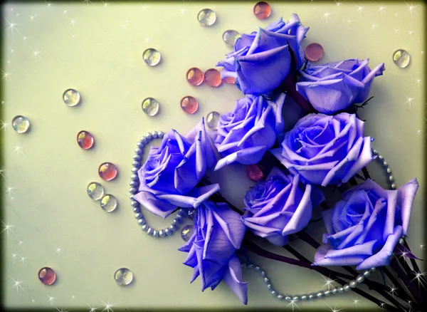 Blue Roses flowers with a pearl bead thread with glass balls — Stock Photo, Image