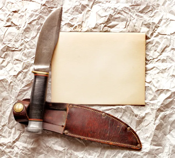 Close up view of knife on vintage paper — Stock Photo, Image