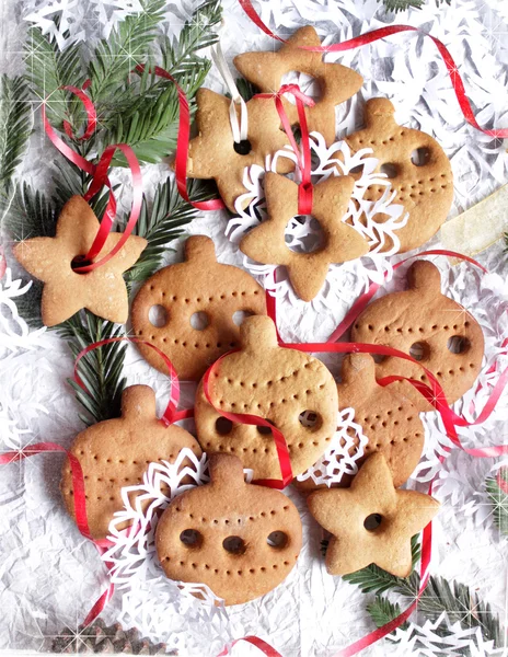 Jul bakgrund med cookies, fir-trädgrenar och snöflinga — Stockfoto