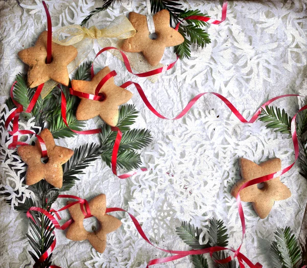Χριστούγεννα φόντο με τα cookies, τα κλαδιά του ελάτου και νιφάδα χιονιού — Φωτογραφία Αρχείου