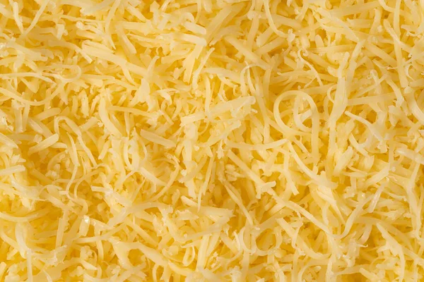烤奶酪背景纹理 黄色切碎的奶酪 关闭顶部视图 — 图库照片