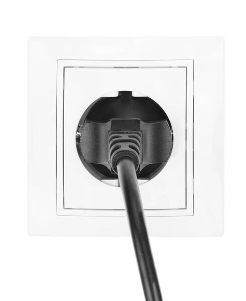 Power European electric plug isolated on a white. black electric cord plugged into a white electricity socket on white background