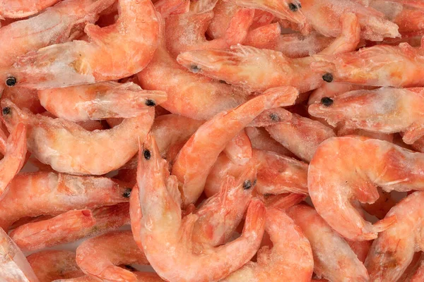 Unpeeled  frozen shrimp background texture