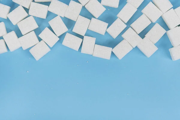 Cubos Naturales Azúcar Blanco Aislados Sobre Fondo Azul — Foto de Stock