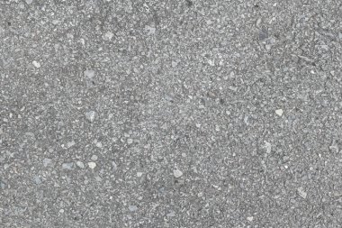 Kırık eski asfaltın dokusu. Yakın çekim.