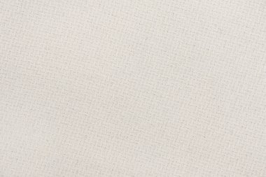 Örgü yün kumaş arka planının beyaz doğal dokusu. Beyaz pamuk kumaş, örülmüş tuval dokusu