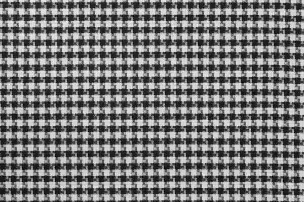 White black textile cloth texture background. shirt fabric with a checkered pattern. factory material