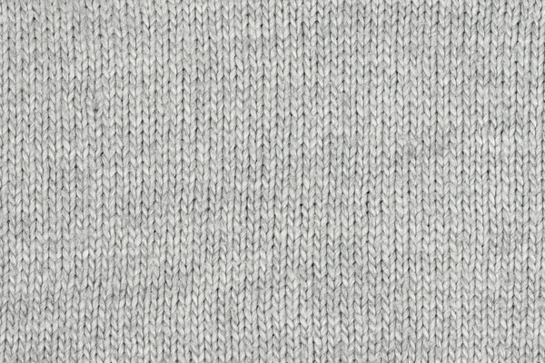 Örgü yün kumaş arka planının beyaz doğal dokusu. Beyaz pamuk kumaş, örülmüş tuval dokusu