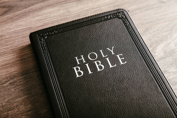 Holy Bible on the wooden table backgroun