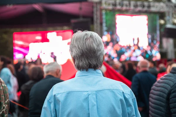 people in demonstration or a concert in cit