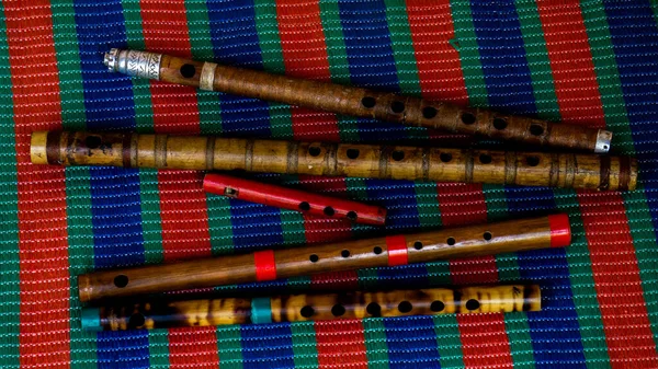 Flute of Bangladesh. Handmade bamboo flute. The flutes are arranged in rows. Close-up image of the flute.