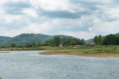 amazing view of the river with mountains on the background