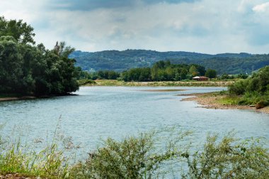 amazing view of the river with mountains on the background