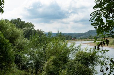 amazing view of the river with mountains on the background