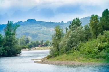 amazing view of the river with mountains on the background
