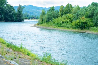 amazing view of the river with mountains on the background