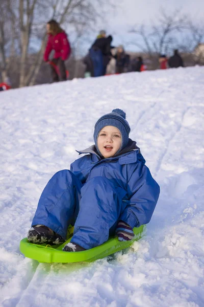 Young boy on his sledge — Stock Photo, Image