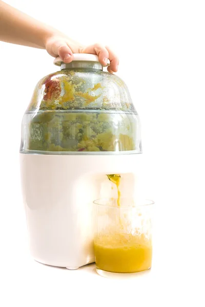 Child hand pressed on juice maker — Stock Photo, Image