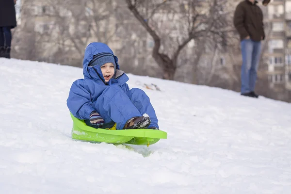 Young boy on sledge — Stock Photo, Image