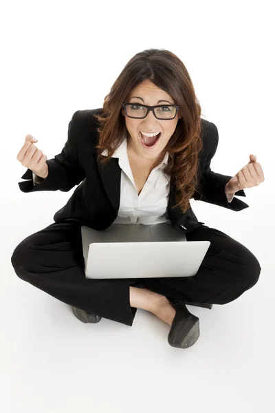 Excited woman with arms up winning online — Stock Photo, Image