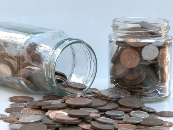 Coins in Jars — Stockfoto