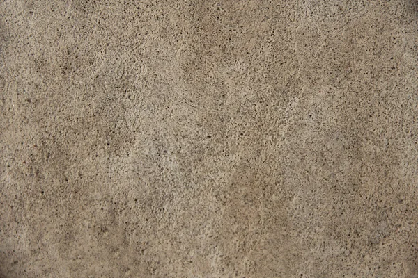 Close-up de uma parede sólida com recessos irregulares — Fotografia de Stock