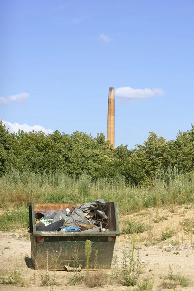 Dumpster and chimney — Stock Photo, Image