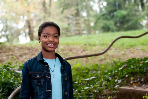 African-American girl in a meadow — Stock Photo, Image