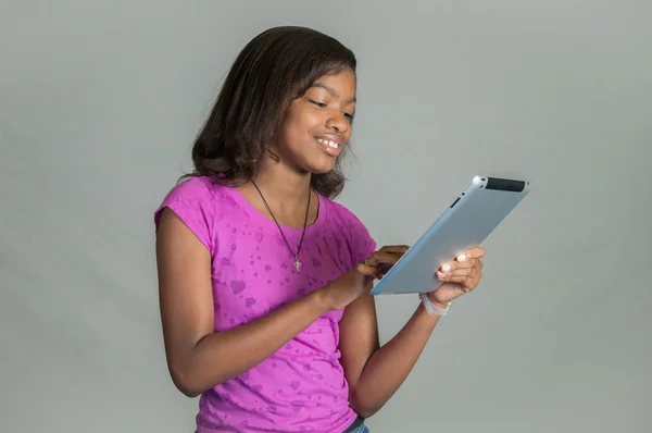 Fille avec une tablette . Images De Stock Libres De Droits