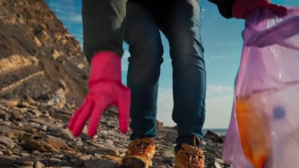 Volunteer Protective Gloves Collects Plastic Bottles Wild Beach Puts Them — Stock Video