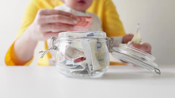 Mother Little Child Counting Money Putting Glass Jar Close Slow — Vídeos de Stock