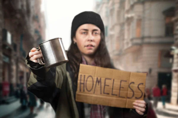 Defocused Beggar Woman Holds Cardboard Sign Text Homeless Steel Alms — Stock fotografie