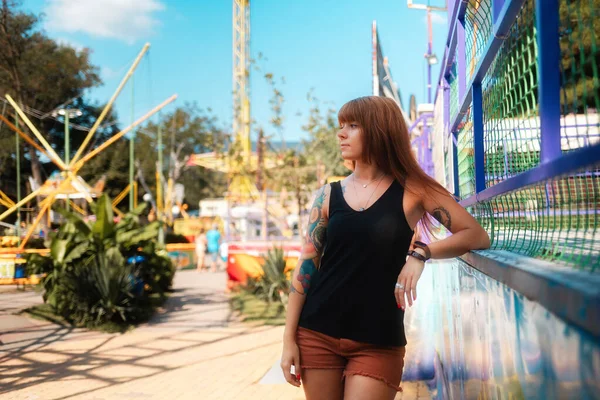Beautiful Young Woman Tattoos Looking Left Posing Amusement Park Concept — Stock fotografie