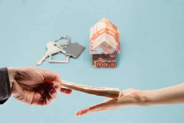 Man Give Stack Money Woman Hand Background Origami House Made — Fotografia de Stock
