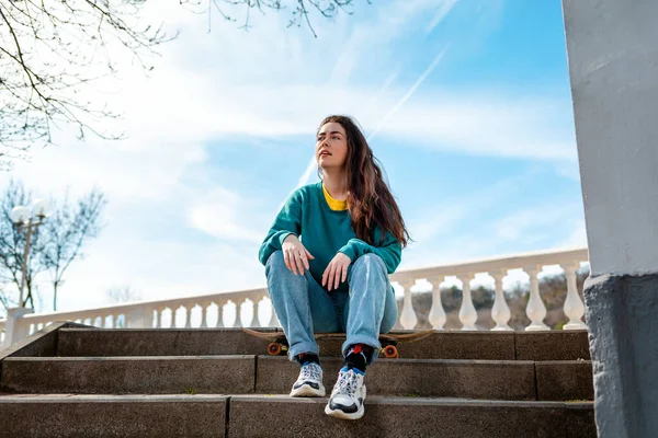 Portrait Cute Caucasian Teen Girl Sitting Skateboard Background Blue Sky — Stockfoto