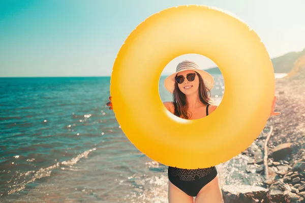 Tanned Young Woman Holds Orange Inflatable Circle Looks Background Wild — Foto de Stock