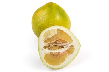 Half of the ripe pomelo fruit cut along, against the whole the same fruit on a white background